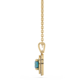 Złota zawieszka z brylantami i niebieskim topazem