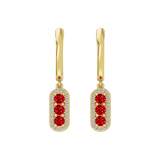 Złote kolczyki wiszące z rubinami i brylantową oprawą