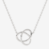 Naszyjnik złoty z brylantami w formie splecionych pierścieni, elegancka biżuteria na każdą okazję