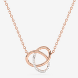 Naszyjnik złoty z brylantami w formie splątanych kółek z różowego złota