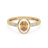 Złoty pierścionek z brylantami z owalnym, żółtym kamieniem w eleganckim designie