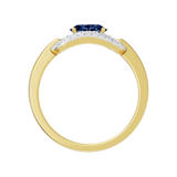 Złoty pierścionek z szafirem i brylantami z eleganckim wykończeniem i błyszczącą obrączką