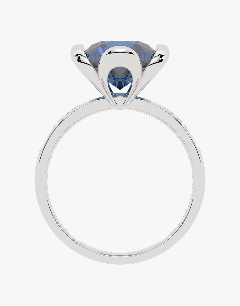 Złoty pierścionek z topazem London Blue z eleganckim szlifem i klasycznym wzornictwem