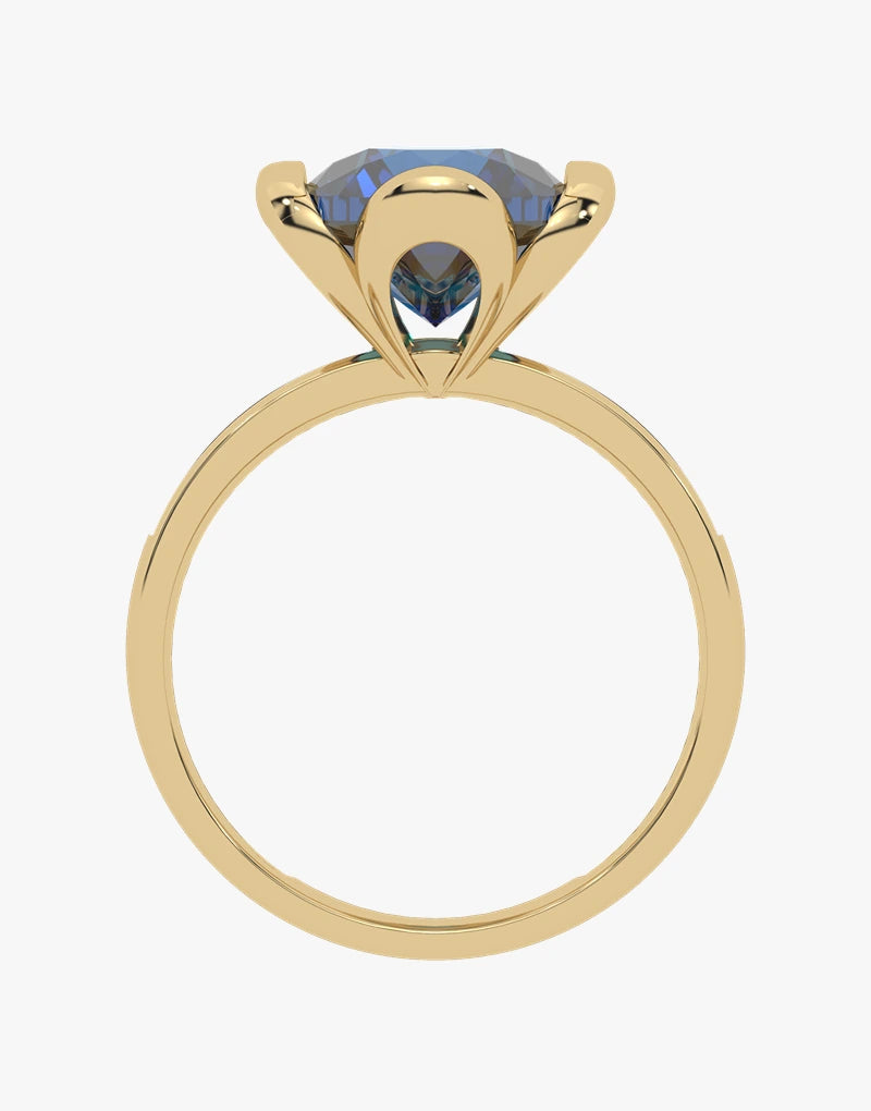 Złoty pierścionek z topazem London Blue z eleganckim szlifem i nowoczesnym wzornictwem