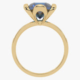 Złoty pierścionek z topazem London Blue z eleganckim szlifem i nowoczesnym wzornictwem