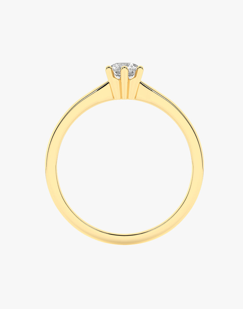 Złoty pierścionek zaręczynowy z brylantem w eleganckim, minimalistycznym wzornictwie