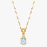 Złoty wisiorek z niebieskim topazem zawieszony na delikatnym łańcuszku od Venetia Jewels