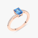 Elegancki pierścionek z topazem i brylantami na różowym złocie, idealny na specjalne okazje