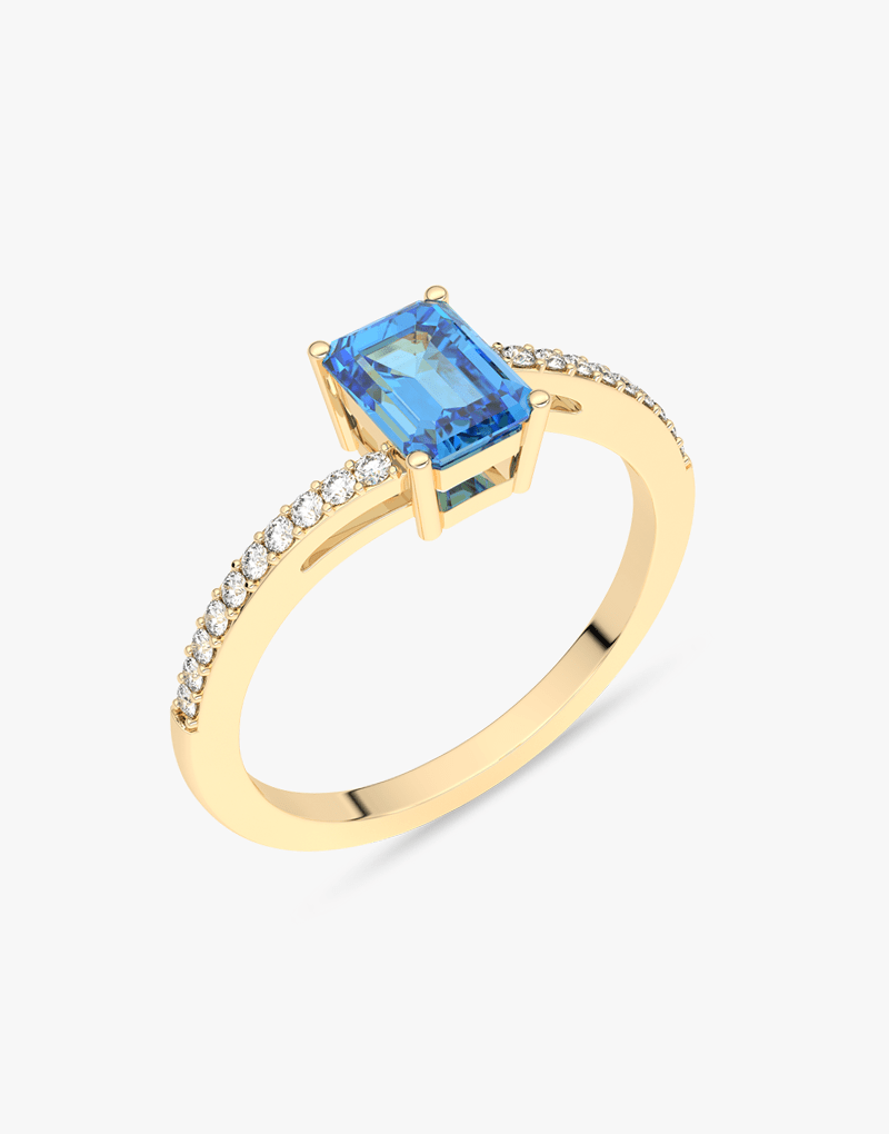 Złoty pierścionek z topazem i brylantami, o eleganckim designie, idealny na specjalne okazje
