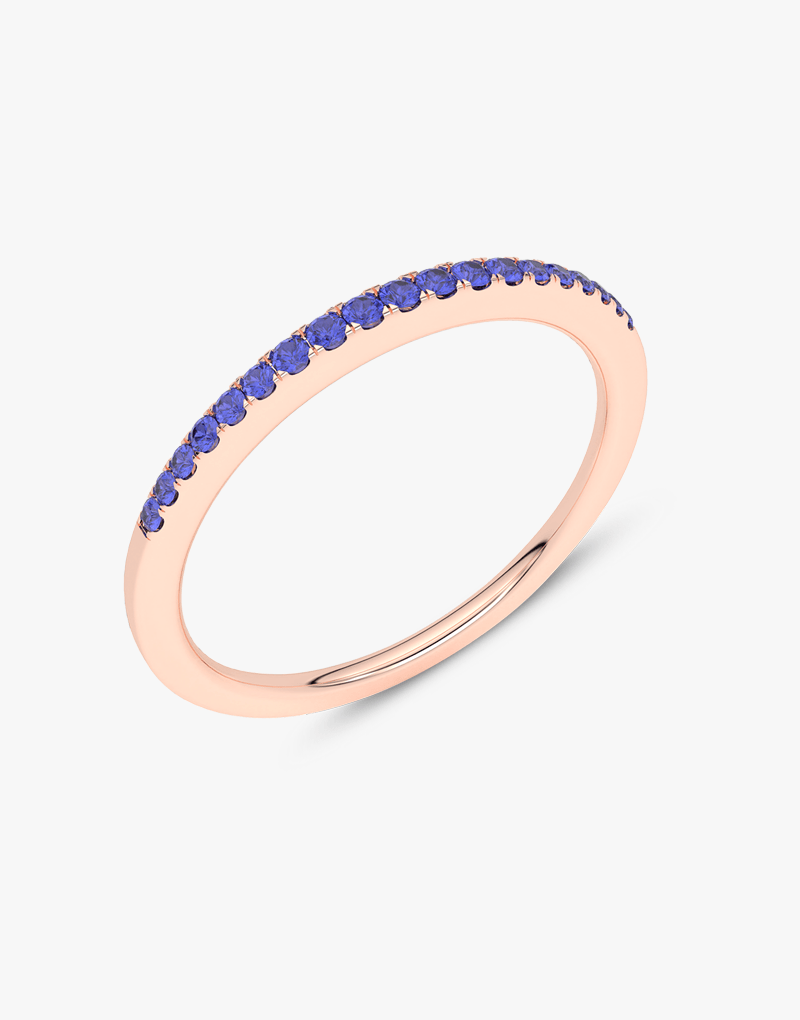 Różowy pierścionek z niebieskim szafirem ozdobiony błyszczącymi kamieniami od Venetia Jewels