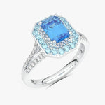 Elegancki pierścionek z niebieskim topazem i brylantami w srebrnej oprawie od Venetia Jewels