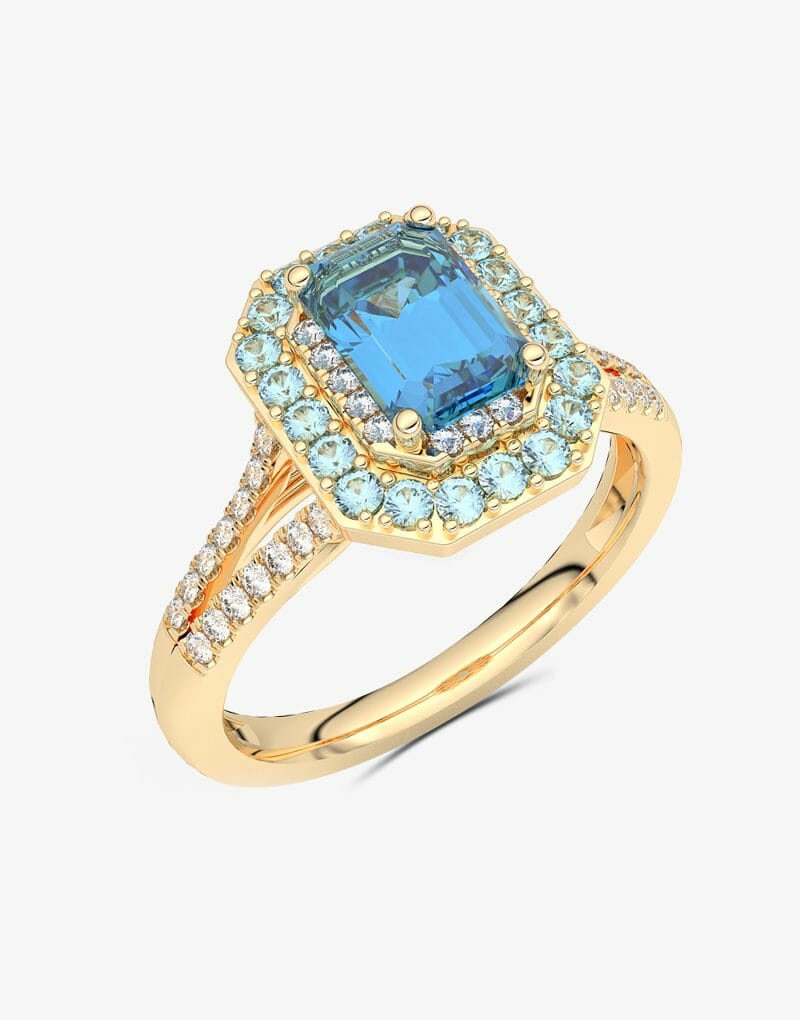 Złoty pierścionek z niebieskim topazem i brylantami w eleganckim designie dla miłośników biżuterii