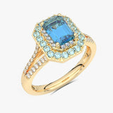 Złoty pierścionek z niebieskim topazem i brylantami w eleganckim designie dla miłośników biżuterii