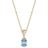 Złoty wisiorek z Niebieskim Topazem i brylantami