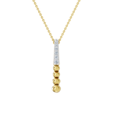 Złota zawieszka z pionowym brylantowym akcentem i złotymi kuleczkami