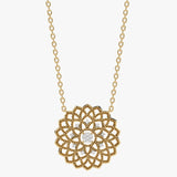 Gold necklace with intricate floral pattern and diamonds