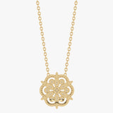 Gold necklace with flower pendant and diamond accent