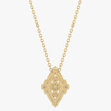 Gold pendant with an intricate pattern and diamonds