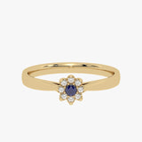 Gold ring with floral pattern and sapphire