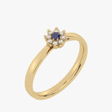 Gold ring with floral pattern and sapphire