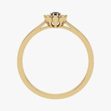 Gold ring with floral pattern and sapphire