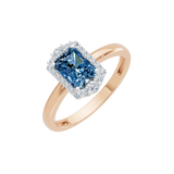 Złoty pierścionek z niebieskim topazem i brylantami