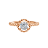 Gold ring with a round motif and diamonds