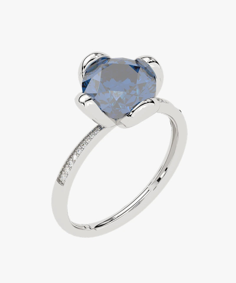 Złoty pierścionek z topazem London Blue, elegancka biżuteria od Venetia Jewels z diamentowymi akcentami