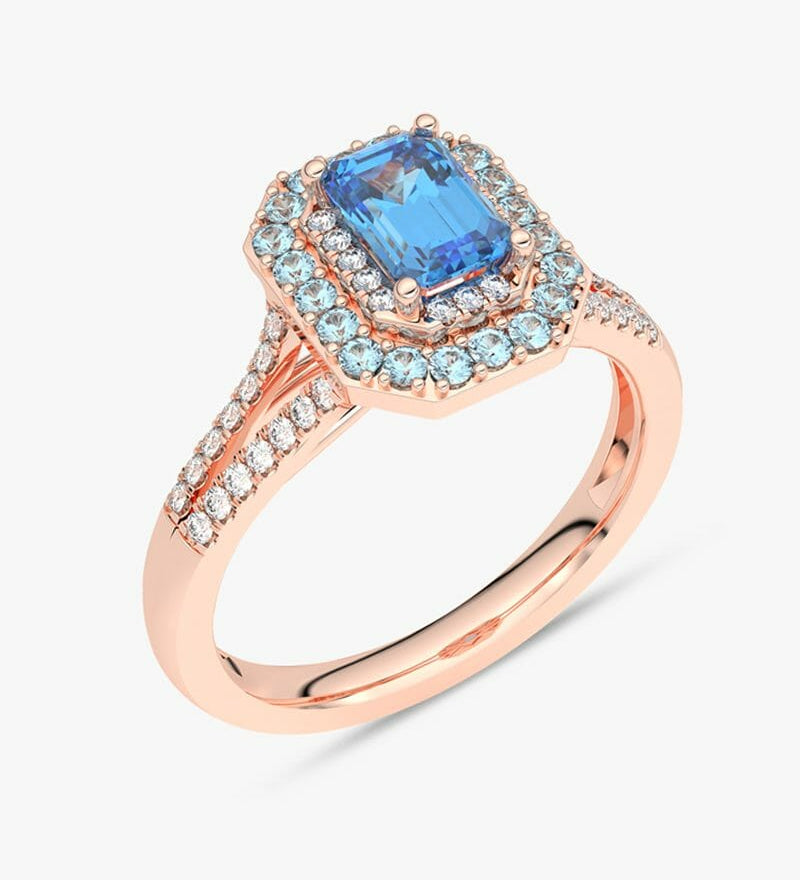 Pierścionek z niebieskim topazem i brylantami w różowym złocie, elegancki i stylowy